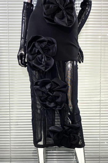 Black dress with floral embellishments on a mannequin against a window blind background