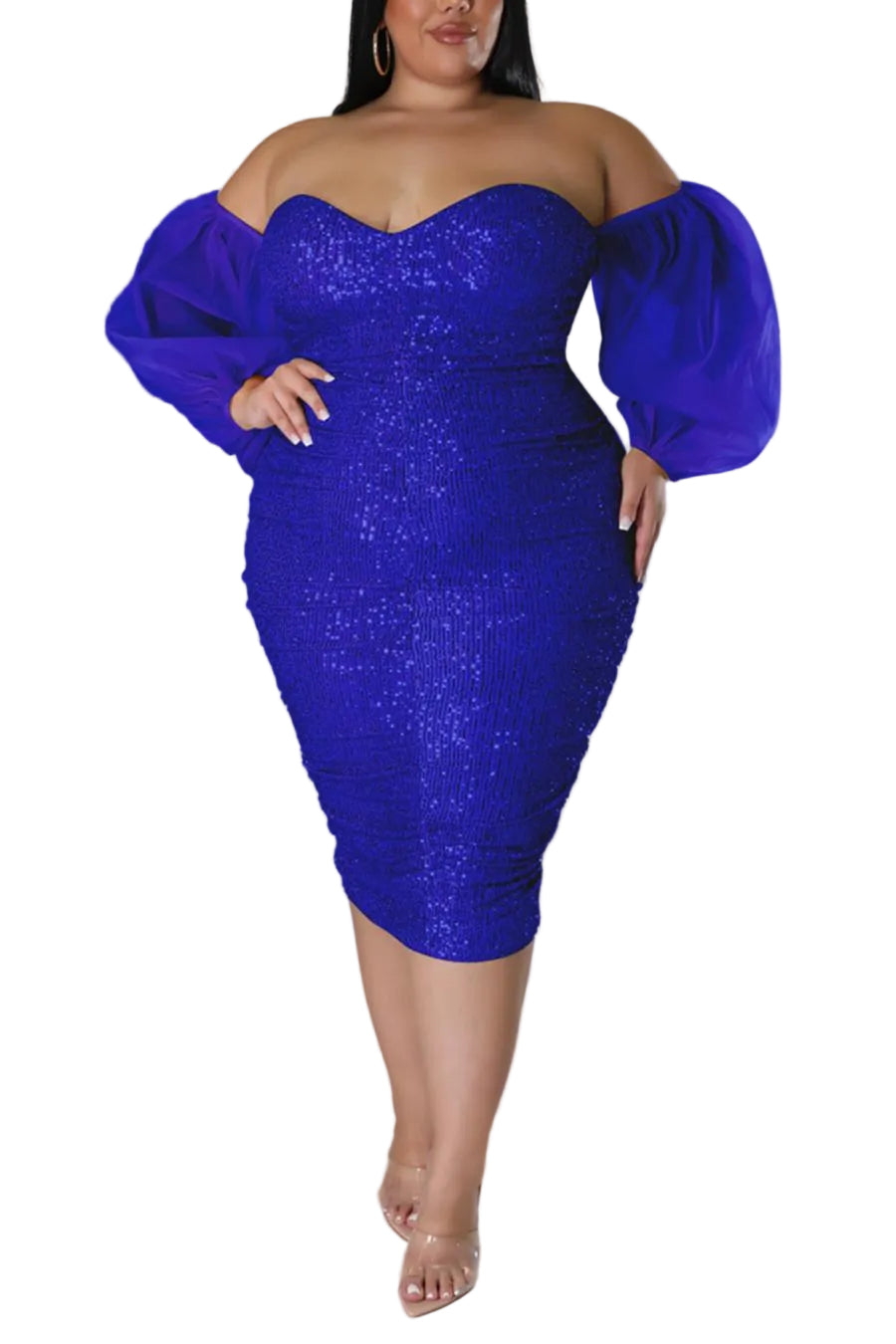 Woman wearing a blue sequin dress against a gray background