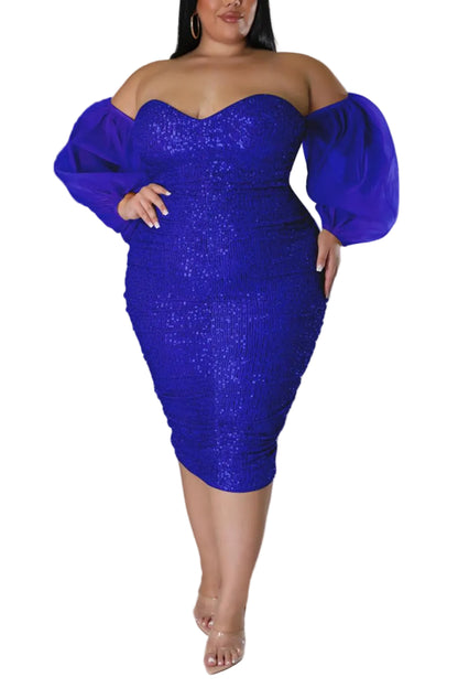 Woman wearing a blue sequin dress against a gray background