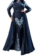 Black evening gown with silver lace details on a white background