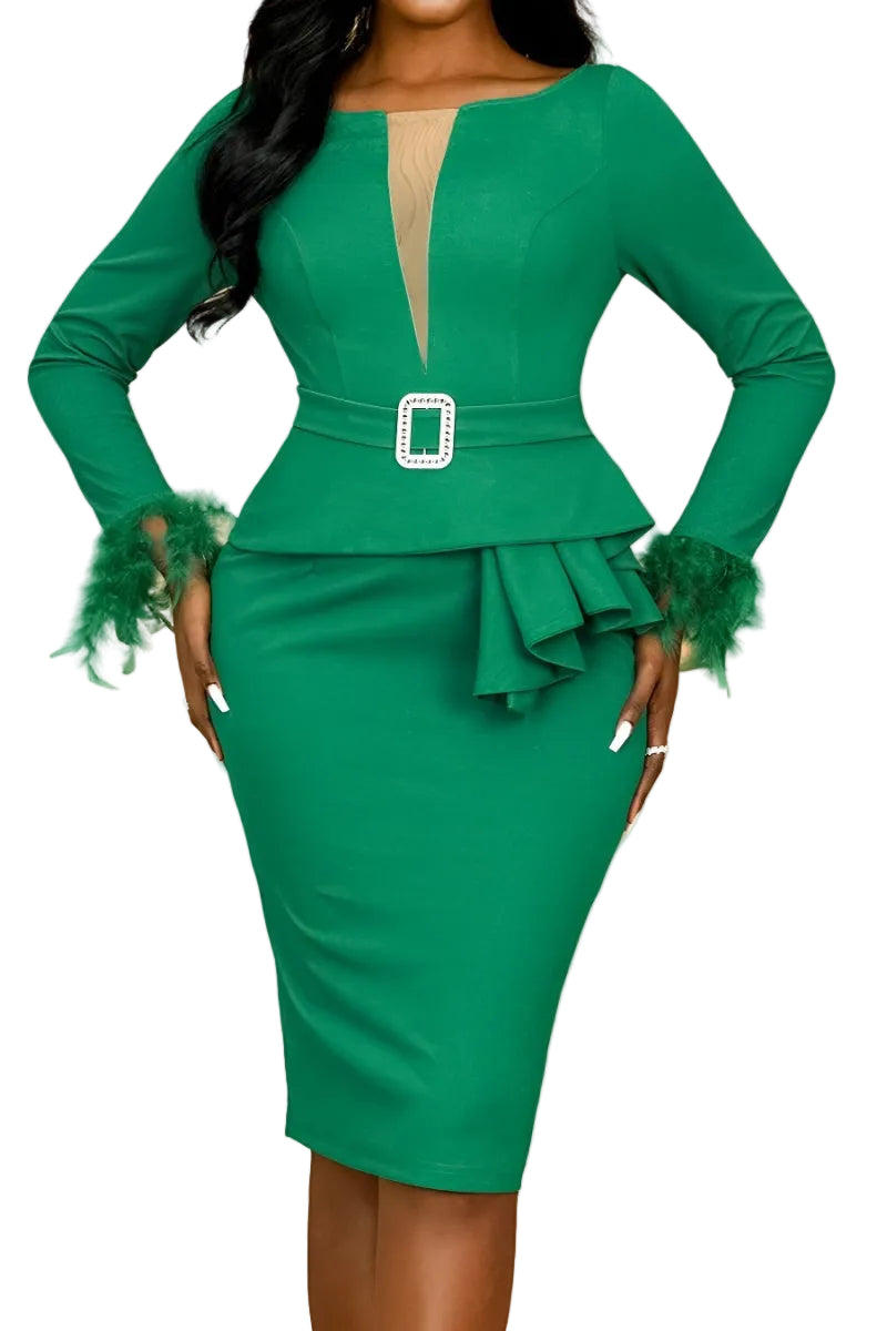 Green dress with ruffled sleeves and a belt on a peach background