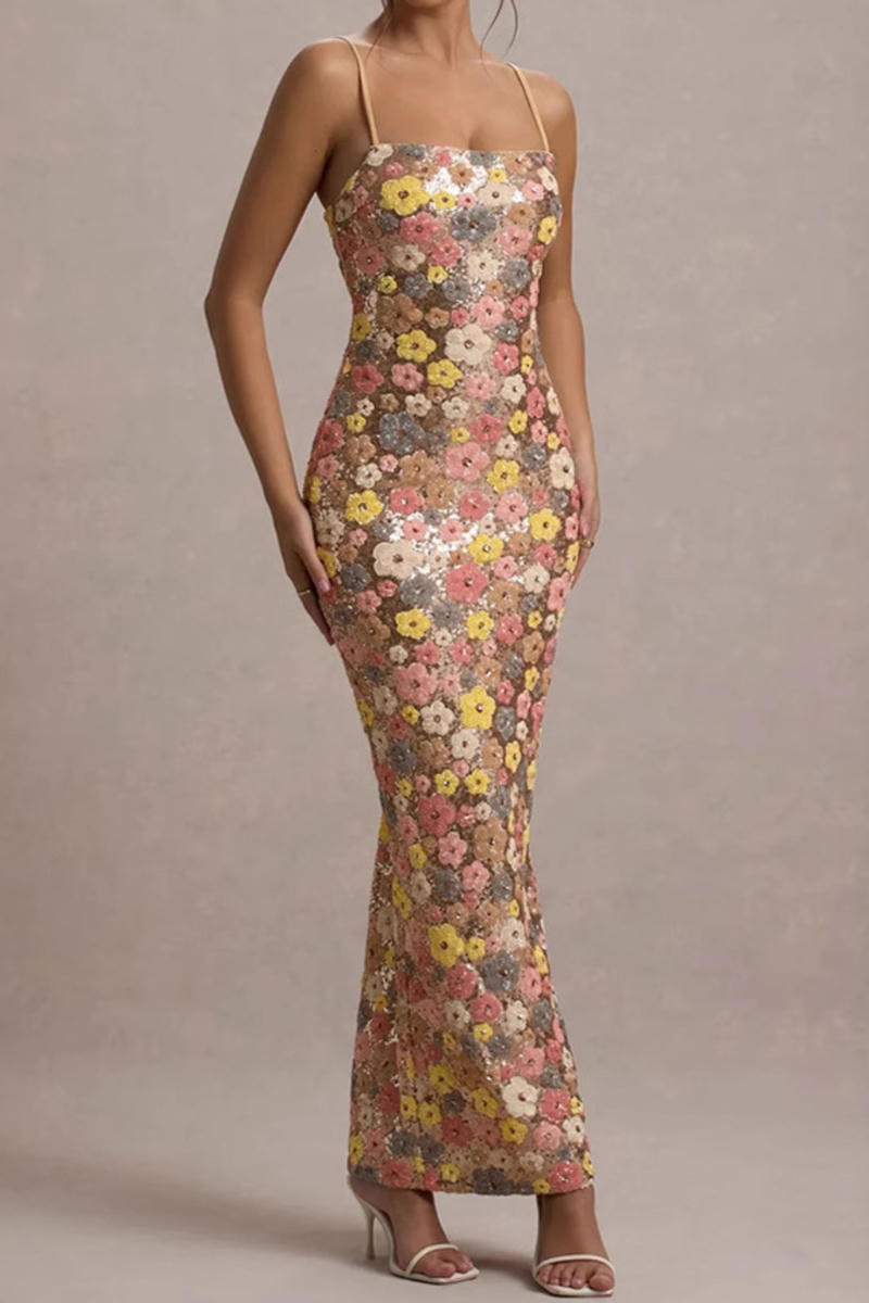 Woman wearing a floral dress against a neutral background