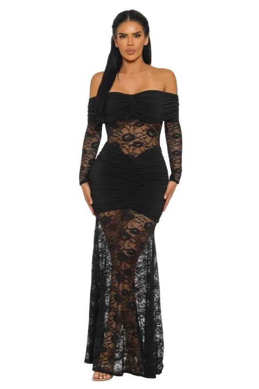 Woman wearing a black lace dress on a white background