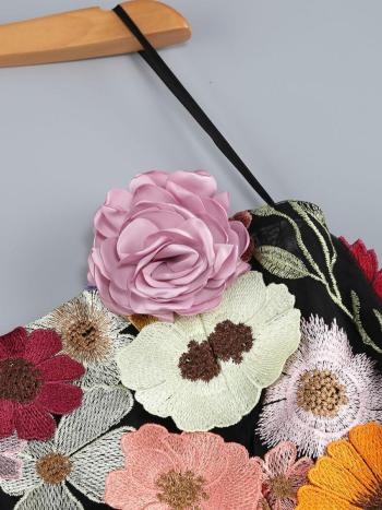 Embroidered fabric with colorful flowers on a gray background