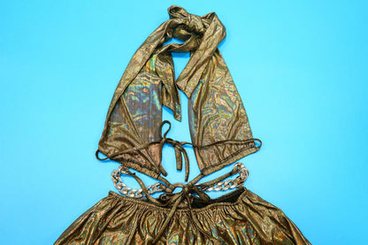 Gold patterned top and skirt set on a blue background