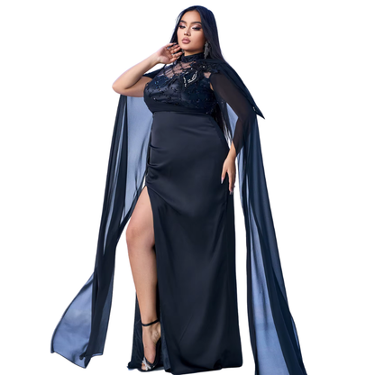 Woman wearing a black dress with a long blue cape on a white background