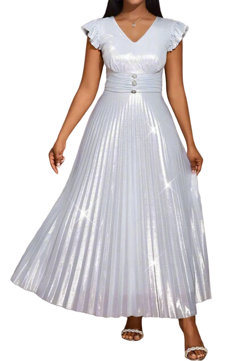 Woman wearing a light blue pleated dress with ruffled sleeves in an indoor setting.