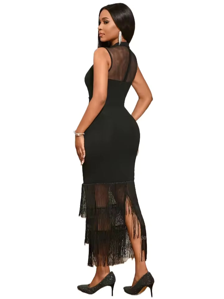 Black dress with sheer panels and lace details on a white background